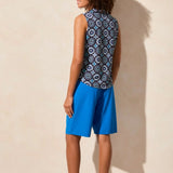 Elevate your style with this polo top featuring an eye-catching textured print. The sleeveless design keeps you cool on warmer days, while the shirttail finish offers a draped look that makes it easy to tuck in.