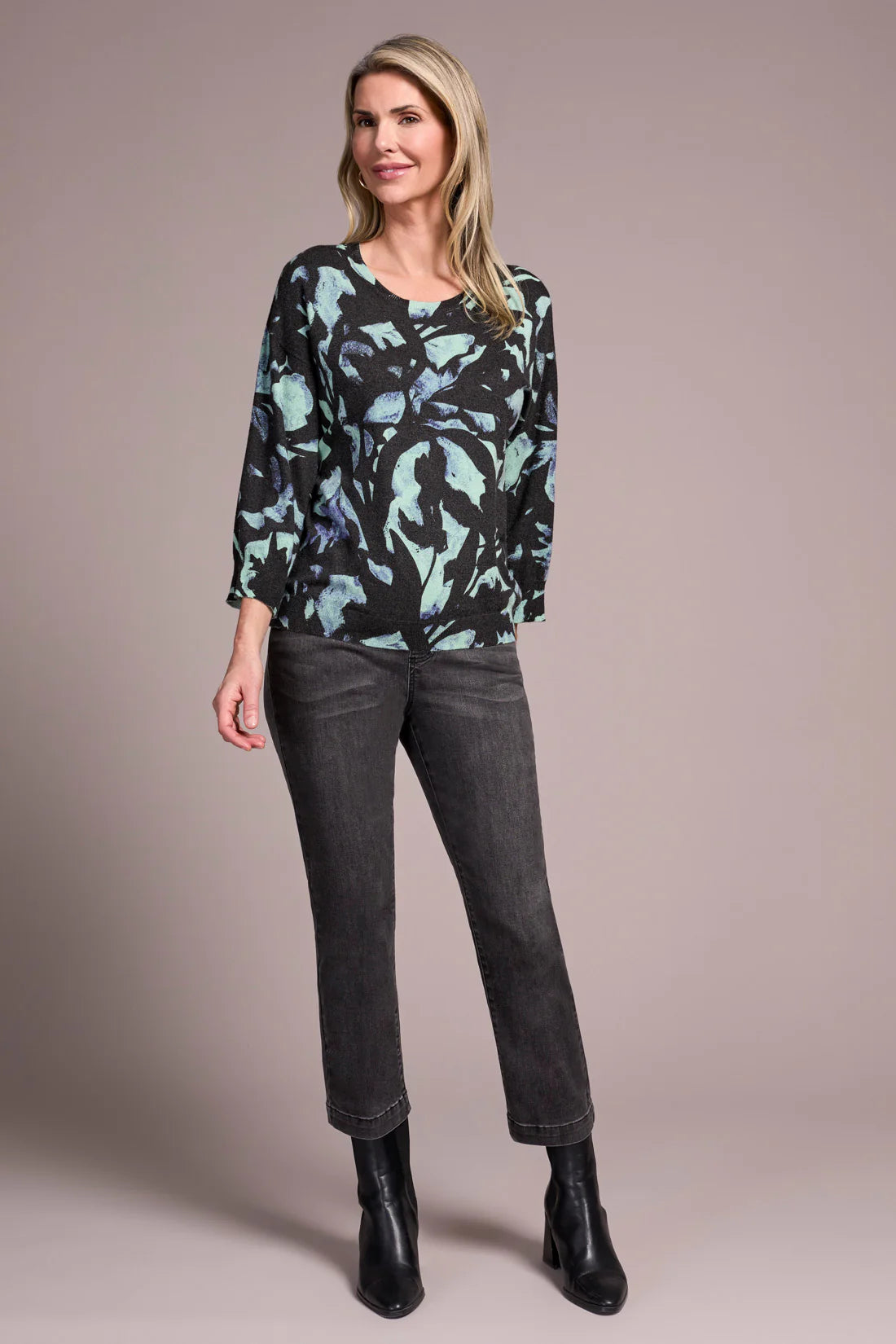 Opt for this relaxed crewneck sweater when you desire casual coziness in a soft yarn blend. The all-over floral print adds an uplifting touch to your look, while drop shoulders enhance comfort and ease of movement. Three-quarter-length sleeves provide the perfect amount of coverage.