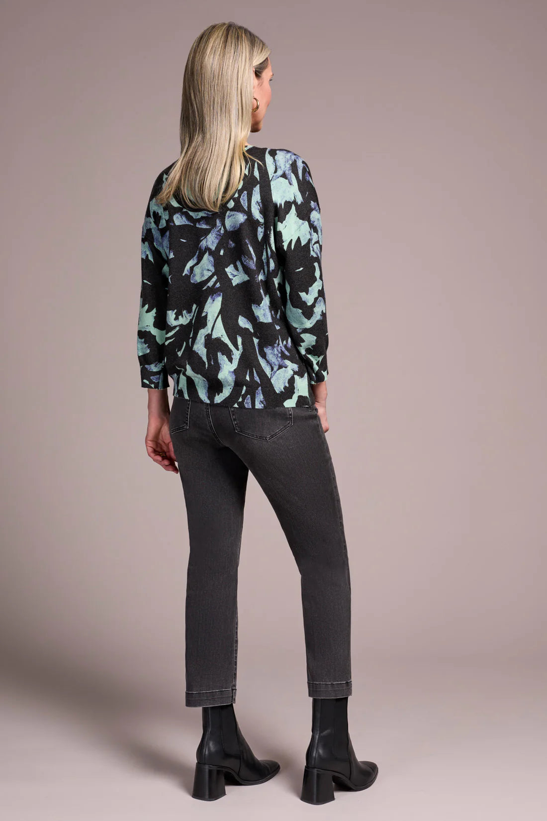 Opt for this relaxed crewneck sweater when you desire casual coziness in a soft yarn blend. The all-over floral print adds an uplifting touch to your look, while drop shoulders enhance comfort and ease of movement. Three-quarter-length sleeves provide the perfect amount of coverage.