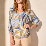 Refresh your wardrobe with this button-front blouse, featuring a vibrant print and textured woven fabric for a luxurious feel. Three-quarter-length sleeves provide ideal coverage, with elastic cuffs that make rolling a breeze. A ruffle detail at the collar adds a subtle touch of finesse.