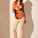 Stay cool and chic on warm days with this breezy sleeveless top, made from a breathable linen-blend knit. The smocked detail adds flattering structure to the elegant notch neckline, while the bold floral print infuses your look with vibrant color and fresh energy.