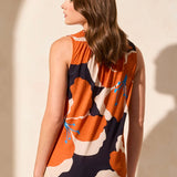 Stay cool and chic on warm days with this breezy sleeveless top, made from a breathable linen-blend knit. The smocked detail adds flattering structure to the elegant notch neckline, while the bold floral print infuses your look with vibrant color and fresh energy.