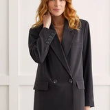 We love combining timeless pieces with trendy embellishments, and this double-breasted blazer showcases that flawlessly. 