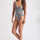 Turn heads in this one-piece swimsuit featuring wrap-front design, v-neckline, and classic silhouette. It's cut from fabric with plenty of stretch and is available in a striking multi coloured tropical print.