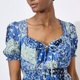 Work boho prints into your weekend wardrobe with this ditsy patchwork mini dress. Framed by a sweetheart neck with a tie and pretty puff sleeves, it's finished with a smocked waist for a comfortable and defining fit. Throw on and go with trainers or sandals on sunny days.