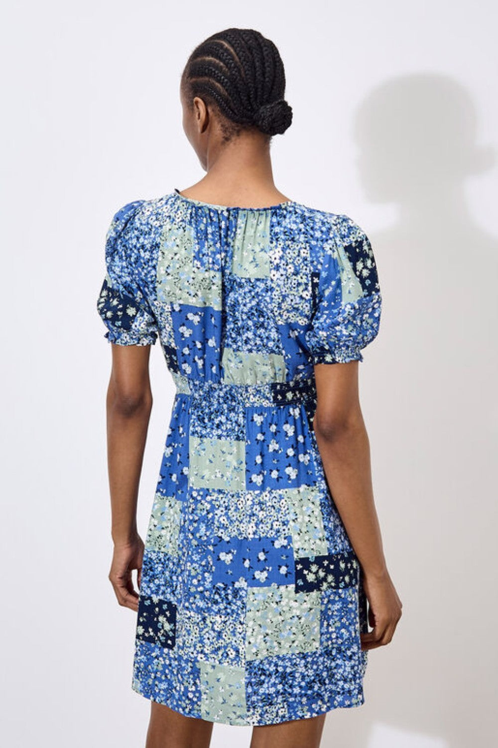 Work boho prints into your weekend wardrobe with this ditsy patchwork mini dress. Framed by a sweetheart neck with a tie and pretty puff sleeves, it's finished with a smocked waist for a comfortable and defining fit. Throw on and go with trainers or sandals on sunny days.