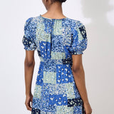 Work boho prints into your weekend wardrobe with this ditsy patchwork mini dress. Framed by a sweetheart neck with a tie and pretty puff sleeves, it's finished with a smocked waist for a comfortable and defining fit. Throw on and go with trainers or sandals on sunny days.