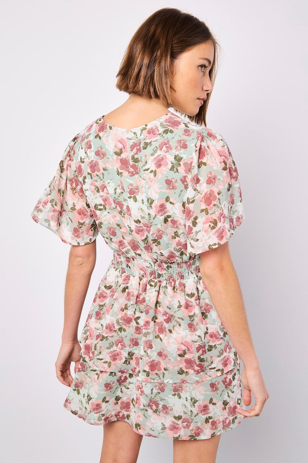 Boasting a mood-boosting watercolour floral print, this mini dress is a must-have for warm days. Crafted from floaty chiffon and lined for comfort, it features a flattering smocked waist, a V-neckline with button-down bodice, and a ruffle-tiered skirt to create movement. Simply style with sandals to complete the look.