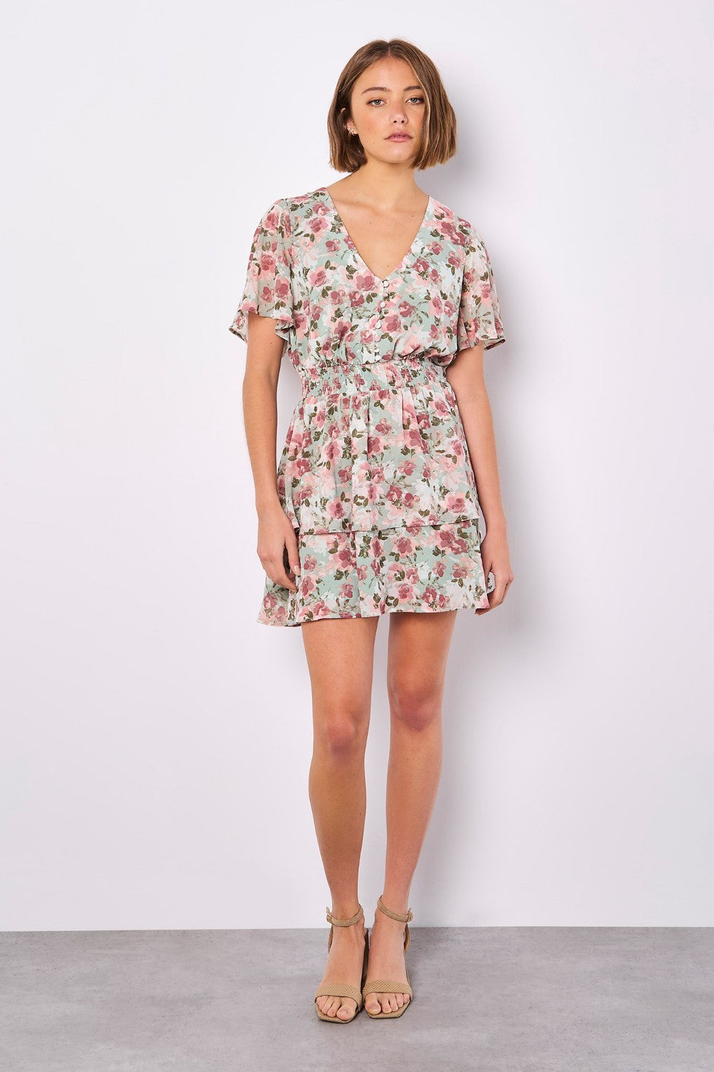 Boasting a mood-boosting watercolour floral print, this mini dress is a must-have for warm days. Crafted from floaty chiffon and lined for comfort, it features a flattering smocked waist, a V-neckline with button-down bodice, and a ruffle-tiered skirt to create movement. Simply style with sandals to complete the look.