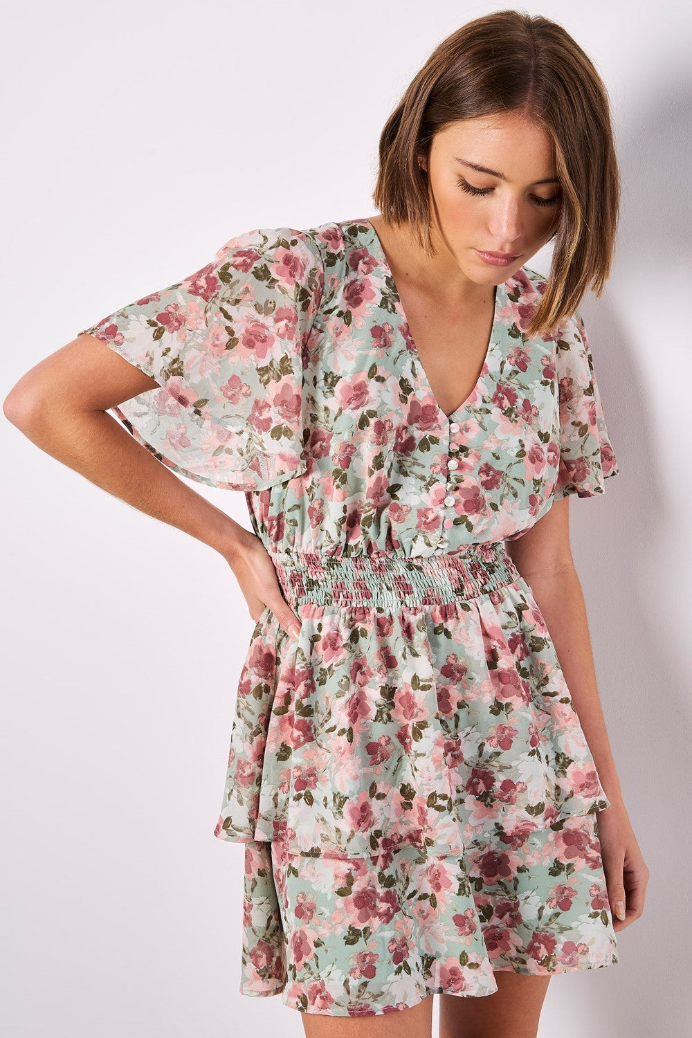 Boasting a mood-boosting watercolour floral print, this mini dress is a must-have for warm days. Crafted from floaty chiffon and lined for comfort, it features a flattering smocked waist, a V-neckline with button-down bodice, and a ruffle-tiered skirt to create movement. Simply style with sandals to complete the look.