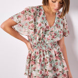 Boasting a mood-boosting watercolour floral print, this mini dress is a must-have for warm days. Crafted from floaty chiffon and lined for comfort, it features a flattering smocked waist, a V-neckline with button-down bodice, and a ruffle-tiered skirt to create movement. Simply style with sandals to complete the look.
