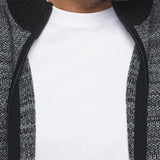 The KOSKI sweater is carefully crafted with an extra fine merino wool blend. It features a ribbed knit stand-up collar, cuffs and waist for a comfortable fit, and a metal zipper for added versatility. The sweater is made from a high twist yarn. which not only enhances its durability but also allows for breathability and makes it hygroscopic, able to manage humidity effectively.