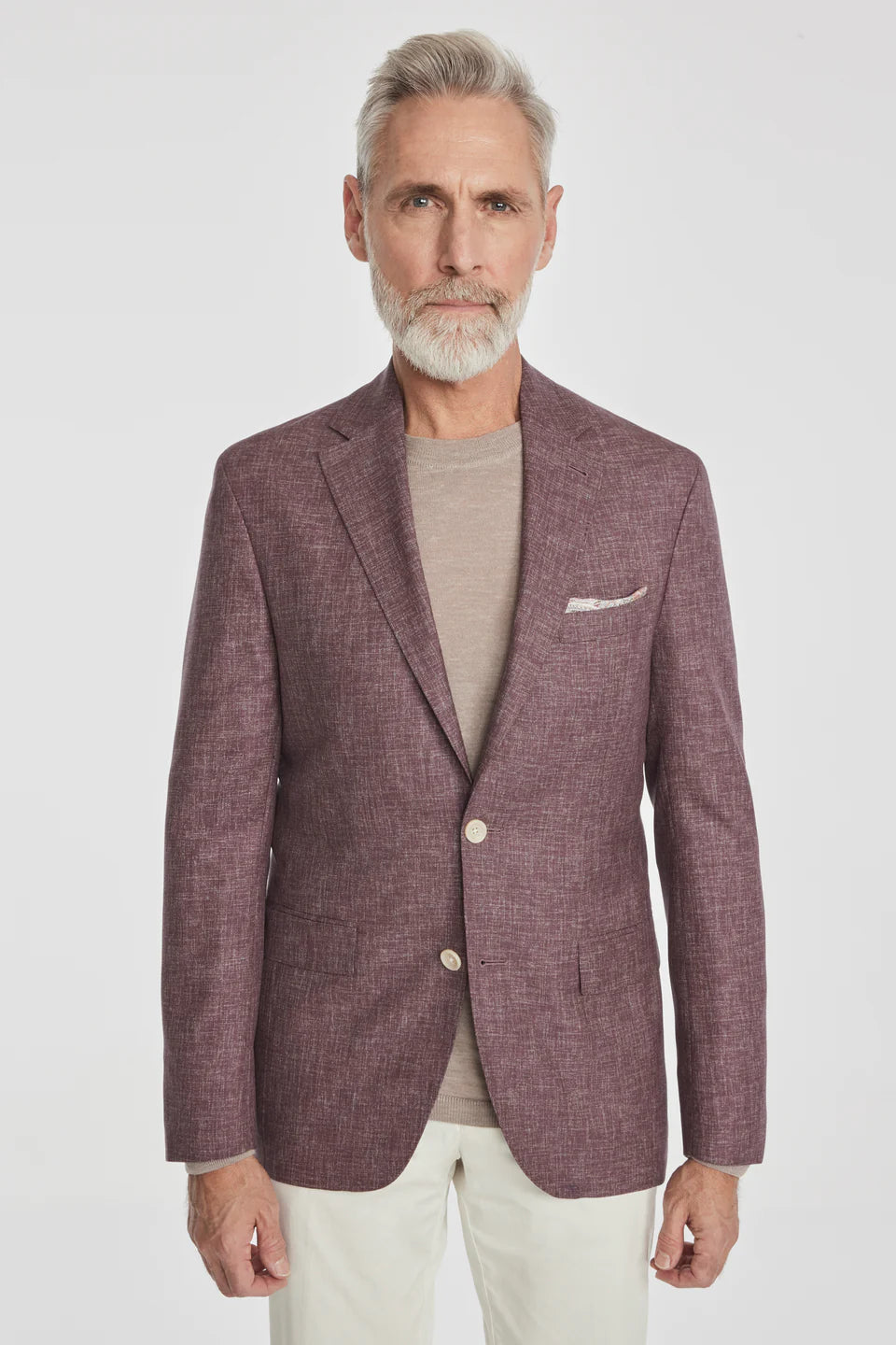 This Midland solid berry blazer is crafted from supersoft and light wool woven in Italy. This fabric allows the wearer to enjoy a crease free linen look thanks to the different colors of yarns used in this 100% worsted wool fabric.