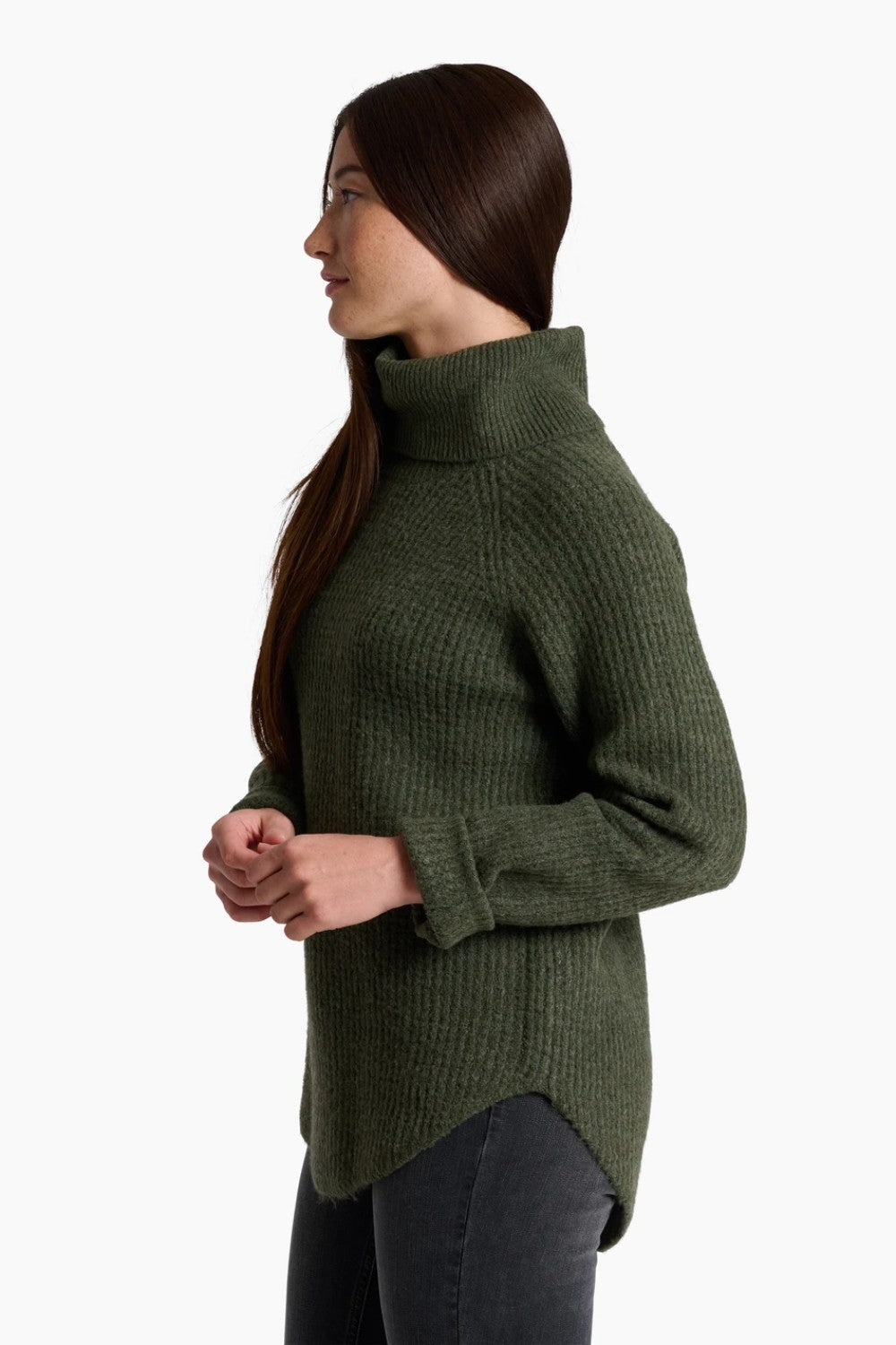 Woman wearing a green ribbed sweater on a white background