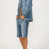 The perfect layer for any season? A men's denim shacket. This stylish top layer combines the structure of a jacket with the ease of a shirt, featuring a relaxed fit and oversized pockets. Wear it open or buttoned up, this jean shacket is sure to be your new staple layer.