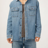 The perfect layer for any season? A men's denim shacket. This stylish top layer combines the structure of a jacket with the ease of a shirt, featuring a relaxed fit and oversized pockets. Wear it open or buttoned up, this jean shacket is sure to be your new staple layer.