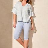 Infuse your day with laid-back elegance in this relaxed blouse, featuring ruffle-finished sleeves adorned with ladder tape detail. A frill accent elegantly frames the poised notch neckline. Made from cotton eyelet gauze, this blouse offers beautiful texture and comfort.