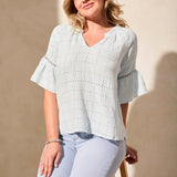 Infuse your day with laid-back elegance in this relaxed blouse, featuring ruffle-finished sleeves adorned with ladder tape detail. A frill accent elegantly frames the poised notch neckline. Made from cotton eyelet gauze, this blouse offers beautiful texture and comfort.