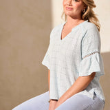 Infuse your day with laid-back elegance in this relaxed blouse, featuring ruffle-finished sleeves adorned with ladder tape detail. A frill accent elegantly frames the poised notch neckline. Made from cotton eyelet gauze, this blouse offers beautiful texture and comfort.