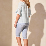 Infuse your day with laid-back elegance in this relaxed blouse, featuring ruffle-finished sleeves adorned with ladder tape detail. A frill accent elegantly frames the poised notch neckline. Made from cotton eyelet gauze, this blouse offers beautiful texture and comfort.