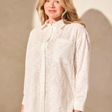 Exquisite embroidered eyelet details enhance the elegance of this classic button-front shirt. The timeless collar frames your face with refined charm, while long sleeves offer comfortable coverage. Crafted from woven cotton fabric, it ensures a breathable feel.