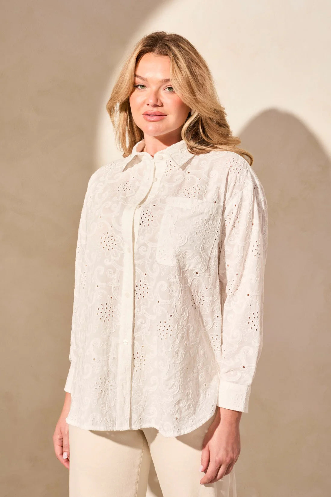 Exquisite embroidered eyelet details enhance the elegance of this classic button-front shirt. The timeless collar frames your face with refined charm, while long sleeves offer comfortable coverage. Crafted from woven cotton fabric, it ensures a breathable feel.