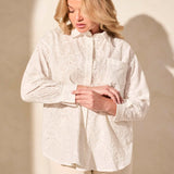 Exquisite embroidered eyelet details enhance the elegance of this classic button-front shirt. The timeless collar frames your face with refined charm, while long sleeves offer comfortable coverage. Crafted from woven cotton fabric, it ensures a breathable feel.