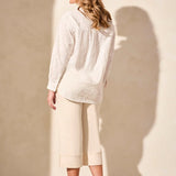 Exquisite embroidered eyelet details enhance the elegance of this classic button-front shirt. The timeless collar frames your face with refined charm, while long sleeves offer comfortable coverage. Crafted from woven cotton fabric, it ensures a breathable feel.