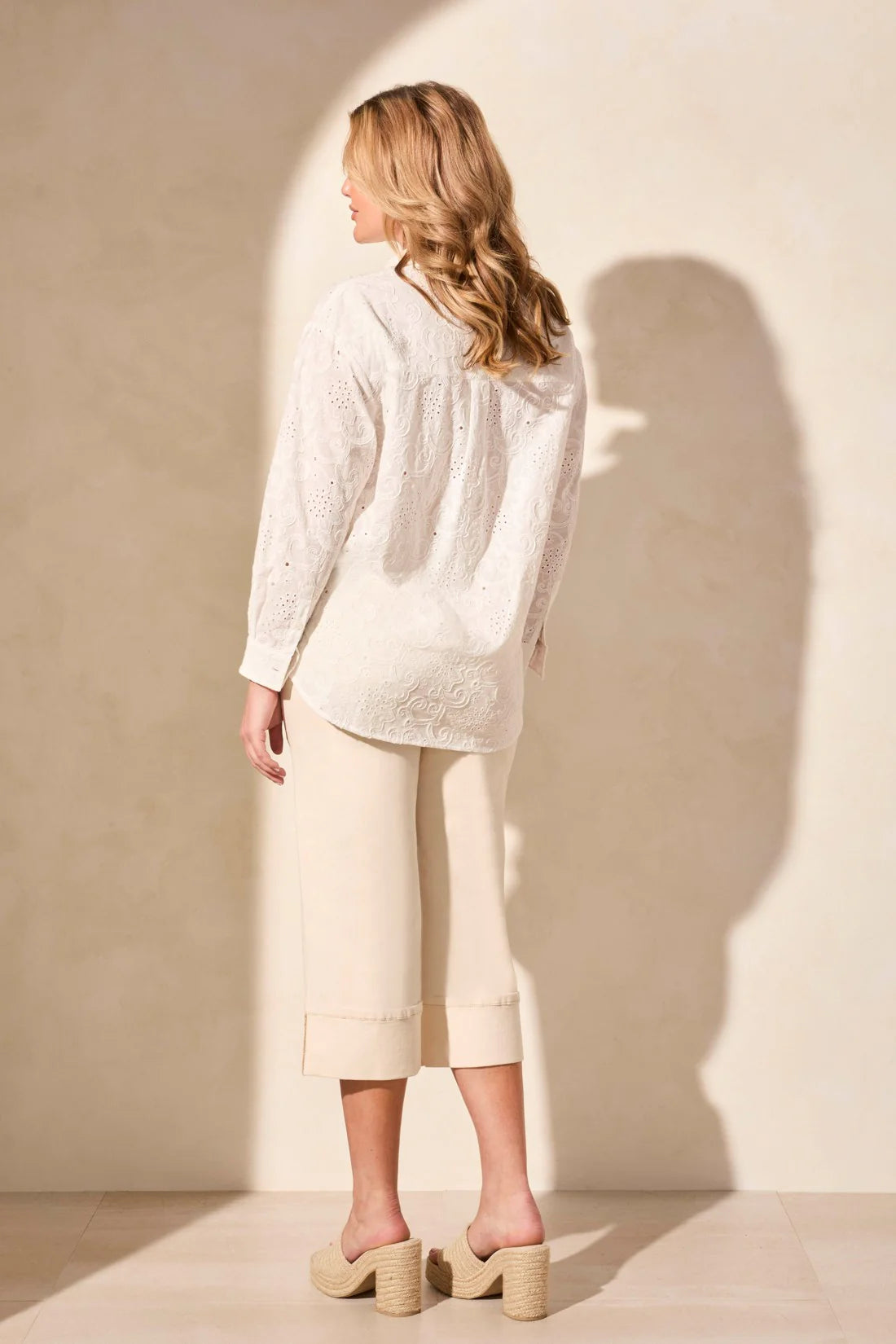 Exquisite embroidered eyelet details enhance the elegance of this classic button-front shirt. The timeless collar frames your face with refined charm, while long sleeves offer comfortable coverage. Crafted from woven cotton fabric, it ensures a breathable feel.