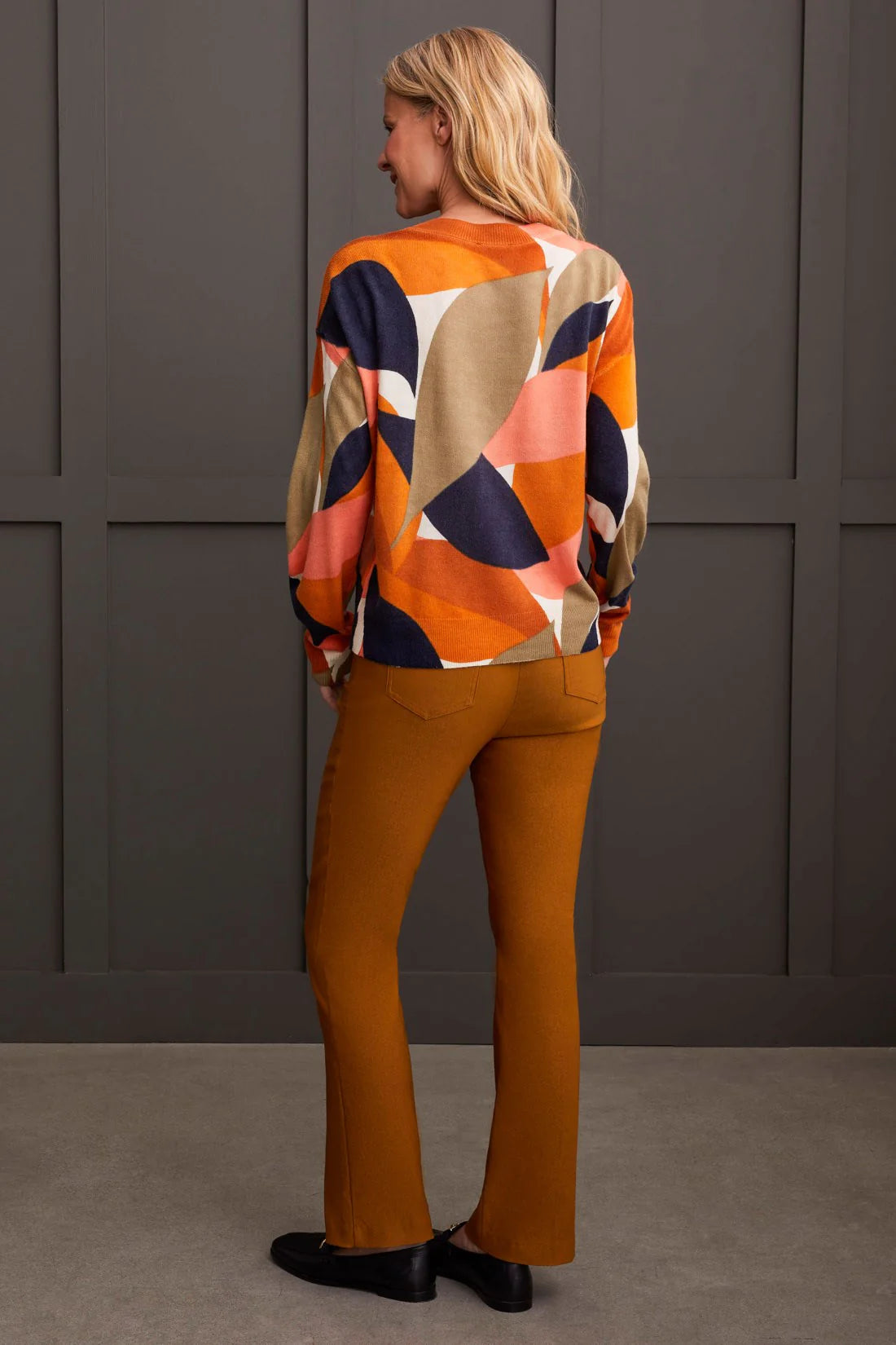 Select a striking style that captivates with this vibrantly patterned crew neck sweater. Its bold, all-over print is guaranteed to turn heads, while the fine gauge knit yarn provides a soft and stretchy feel, ensuring you stay comfortably stylish throughout the day and night.