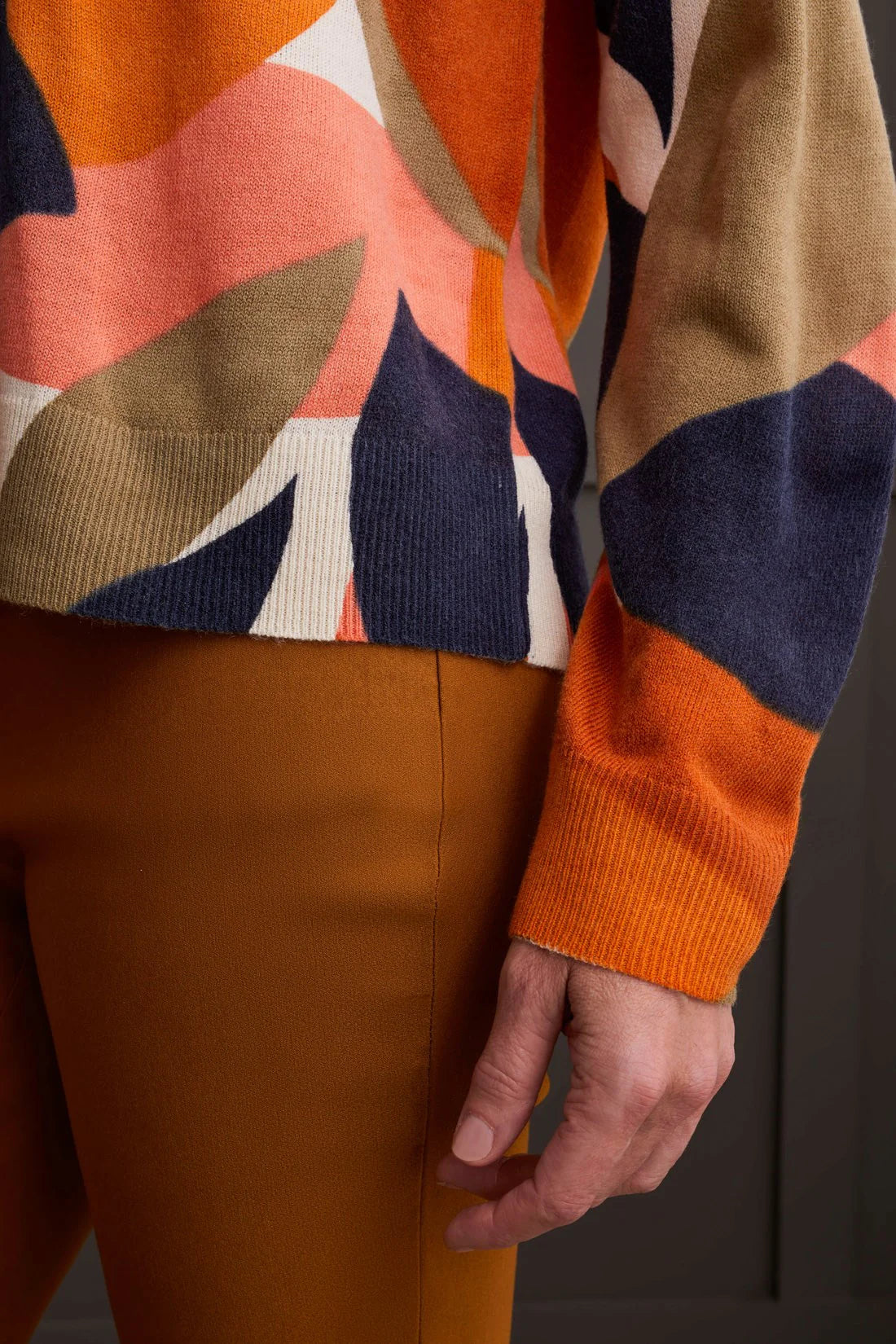 Select a striking style that captivates with this vibrantly patterned crew neck sweater. Its bold, all-over print is guaranteed to turn heads, while the fine gauge knit yarn provides a soft and stretchy feel, ensuring you stay comfortably stylish throughout the day and night.