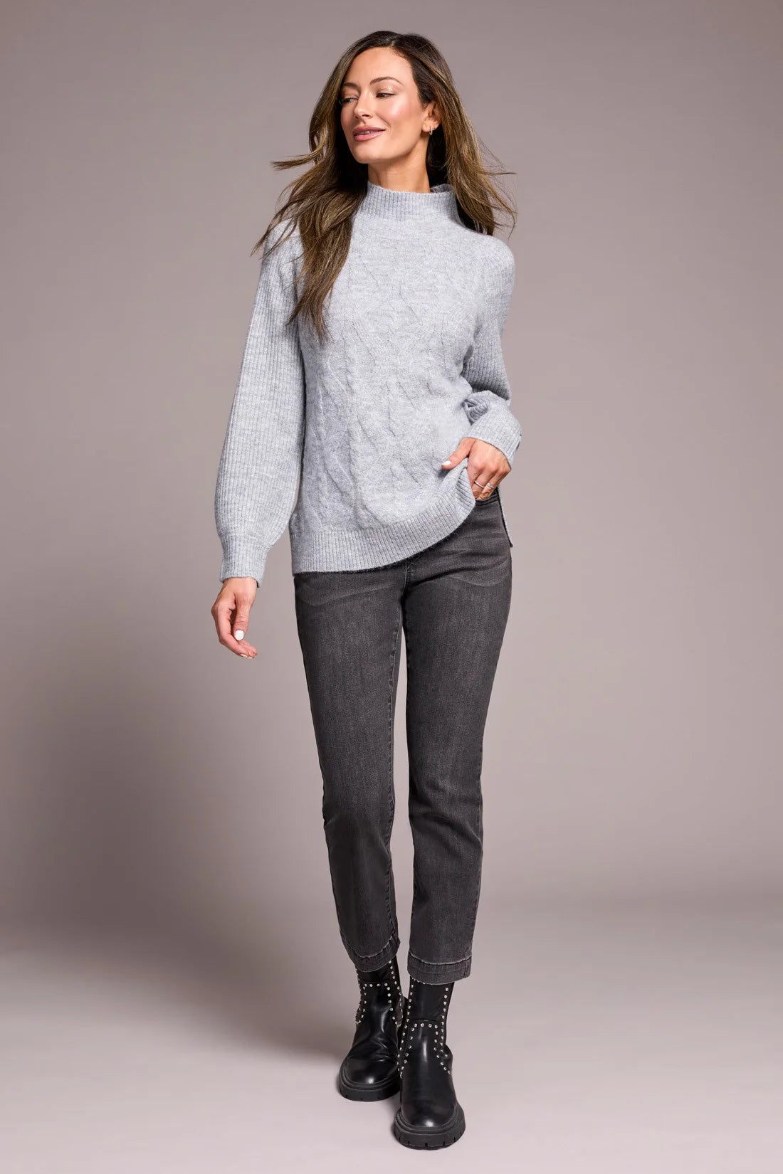 Cooler days call for this cozy sweater, crafted from a soft blend yarn with a rich texture for a luxurious feel. A sleek mock neckline and long puff sleeves add effortless elegance, while fitted cuffs create a refined finish.