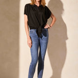 Update your warm-weather wardrobe with this short-sleeve button-front shirt, featuring a playful tie accent at the hem. The classic collar beautifully frames your face, while a shirred back yoke adds flattering structure. Made from airy pique knit, this shirt keeps you feeling fresh all day.