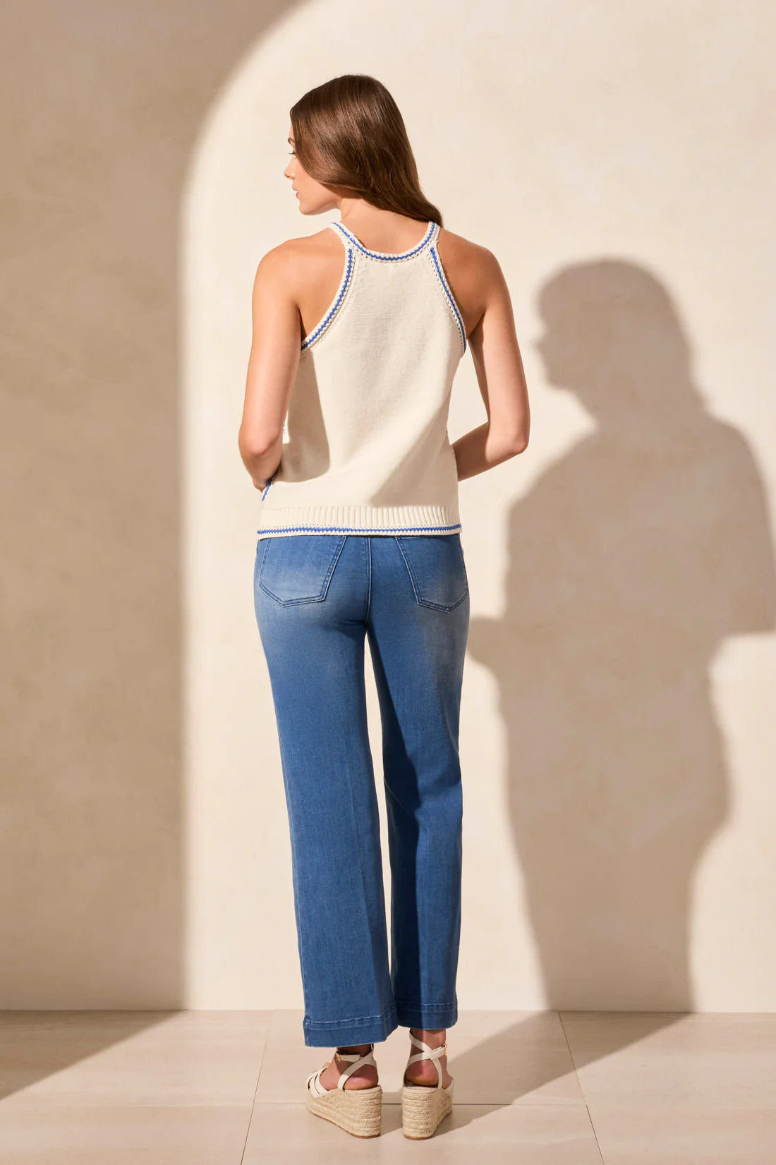 Make a statement in this halter sweater tank, exuding bohemian charm with its vibrant retro crochet design. Delight in the close fit that accentuates your curves, while the contrast ribbed finishing at the hem adds a touch of flair. Crafted from soft yet breathable combed cotton fabric, this tank ensures both comfort and style for any occasion.