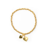 Suzie Blue Elasticated Heart Charm Bracelet In Gold Plate