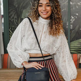 The Louenhide Martina Crossbody Bag is a camera style bag beautifully designed with a stylish pairing of suedette and polyurethane vegan leather. 