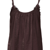 Back of a brown camisole photographed on a light backdrop.