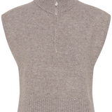 A brown half zip knit vest photographed against a light backdrop.