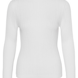 A cream turtleneck photographed against a light backdrop.