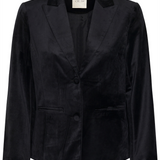 A black velour blazer photographed on a light background.