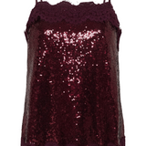 Spaghetti strap sequin top with lace trim photographed against a light background.