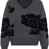 Grey v-neck sweater, with black accents, photographed against a light background.