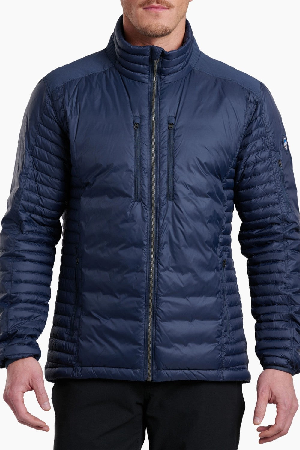 Man wearing a blue puffer jacket on a white background