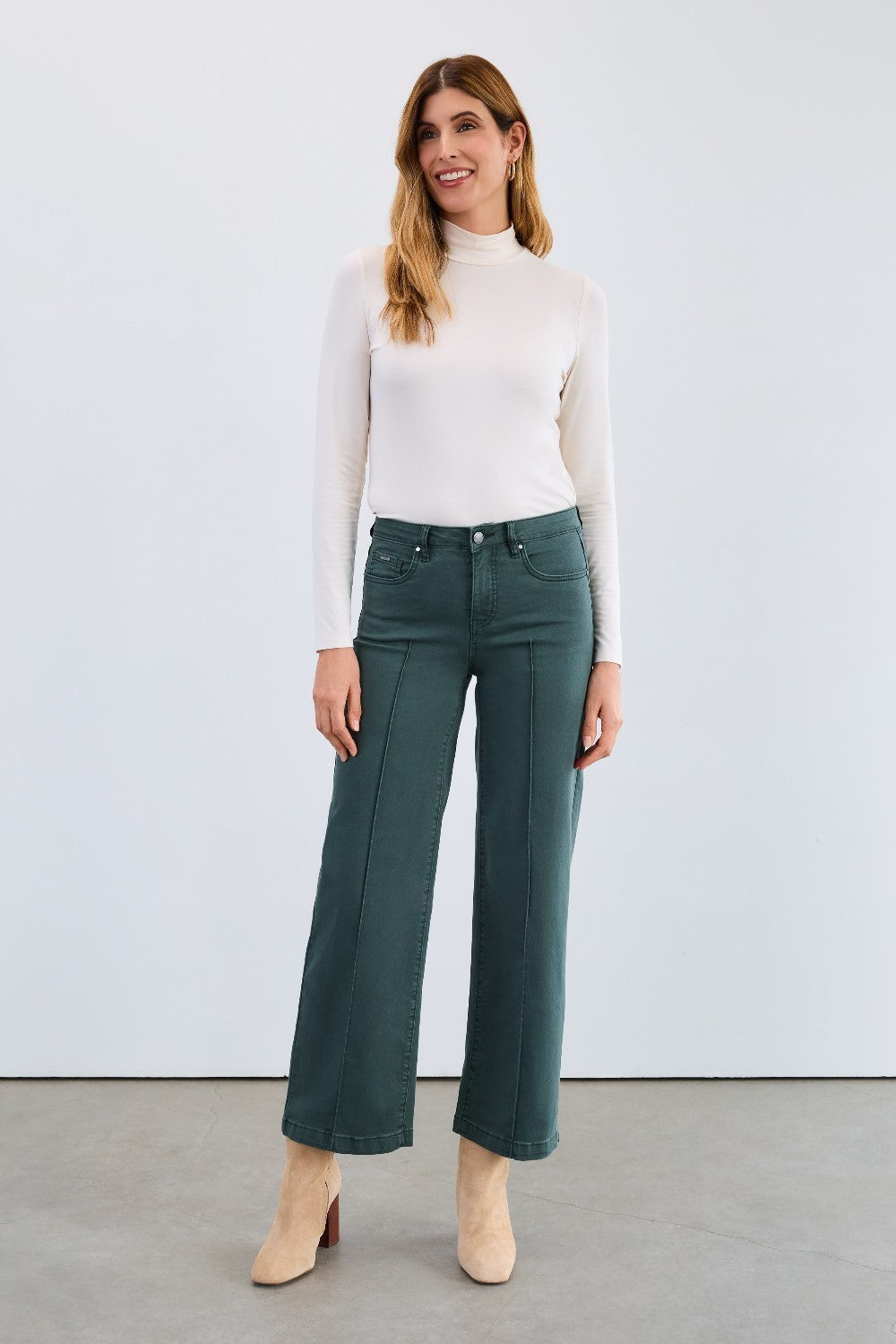 The FDJ Olivia Wide Leg in spruce offers a comfortable and stylish fit with its wide-leg design. Crafted for ease of movement and a flattering silhouette, this piece is perfect for adding a touch of relaxed elegance to your wardrobe. Its versatile spruce colour complements a variety of outfits, making it an essential addition for everyday wear.