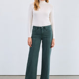 The FDJ Olivia Wide Leg in spruce offers a comfortable and stylish fit with its wide-leg design. Crafted for ease of movement and a flattering silhouette, this piece is perfect for adding a touch of relaxed elegance to your wardrobe. Its versatile spruce colour complements a variety of outfits, making it an essential addition for everyday wear.