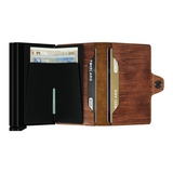 With two Card protectors to hold double the content, the Twinwallet carries up to 16 cards, banknotes and receipts, but remains compact in size. Together with its sturdy closure and exterior, to hold extra cards, banknotes and receipts, the Twinwallet holds much but remains compact in size.