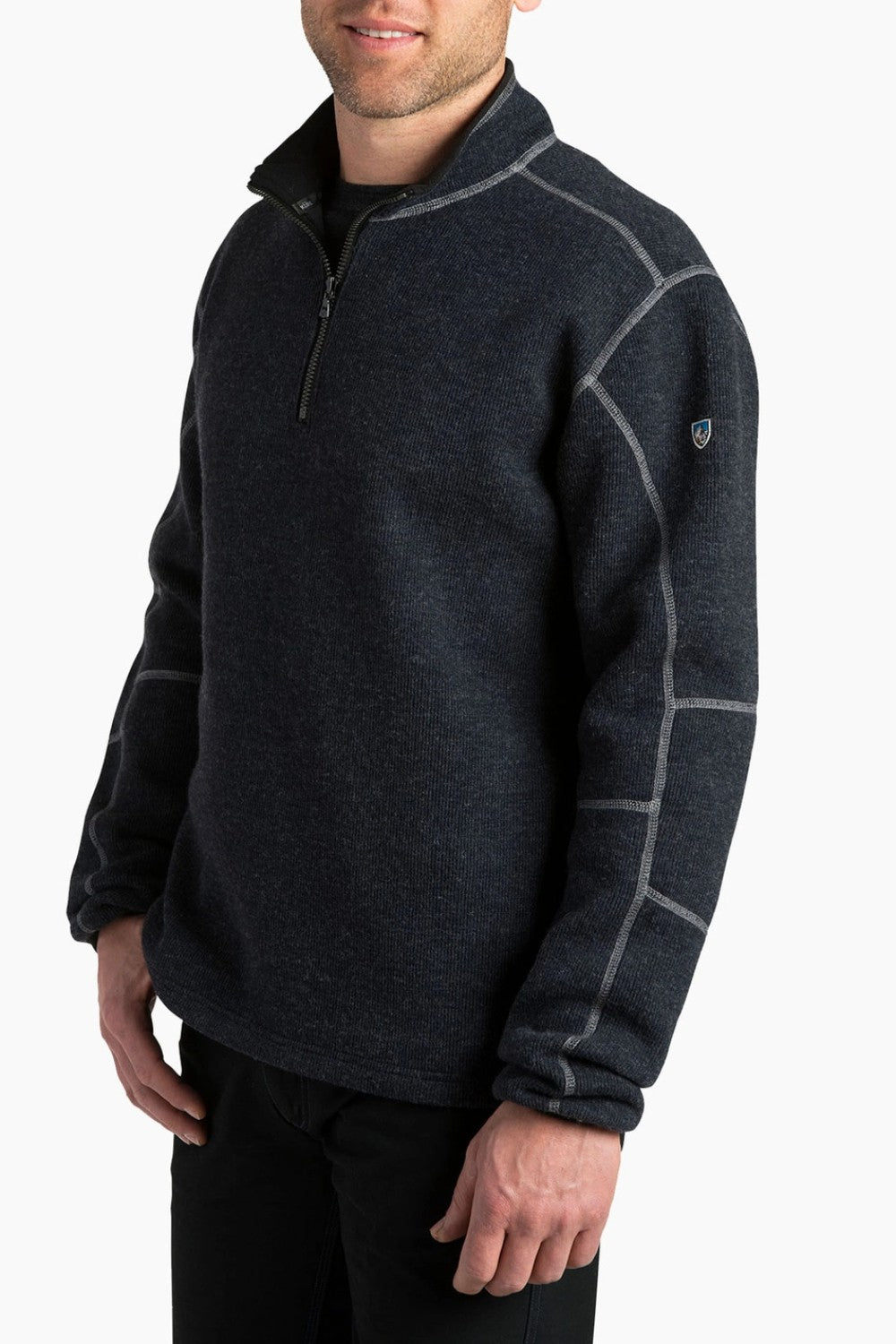 Man wearing a dark gray fleece pullover with a zipper on a white background