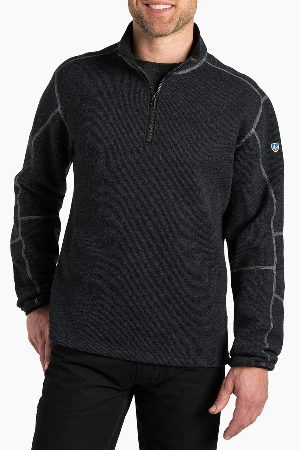 Man wearing a dark gray fleece pullover with a brand logo on a white background