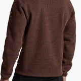 Brown fleece pullover worn by a person on a white background