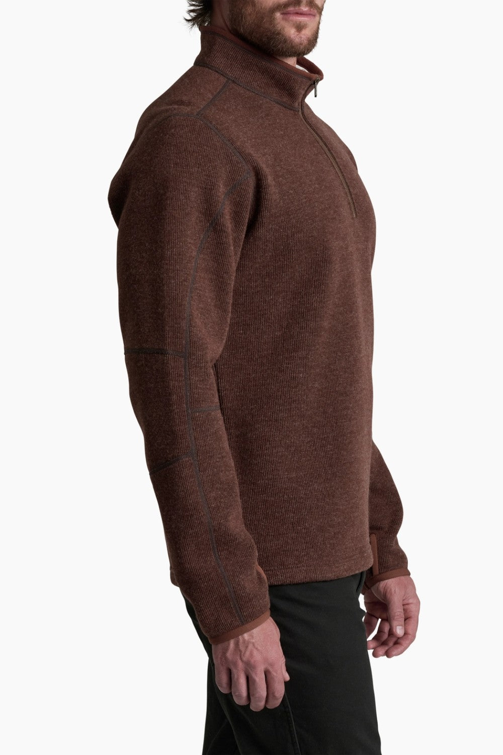 Man wearing a brown turtleneck sweater on a white background